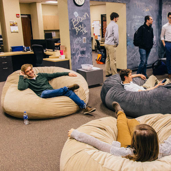 students lying in the lazy couch