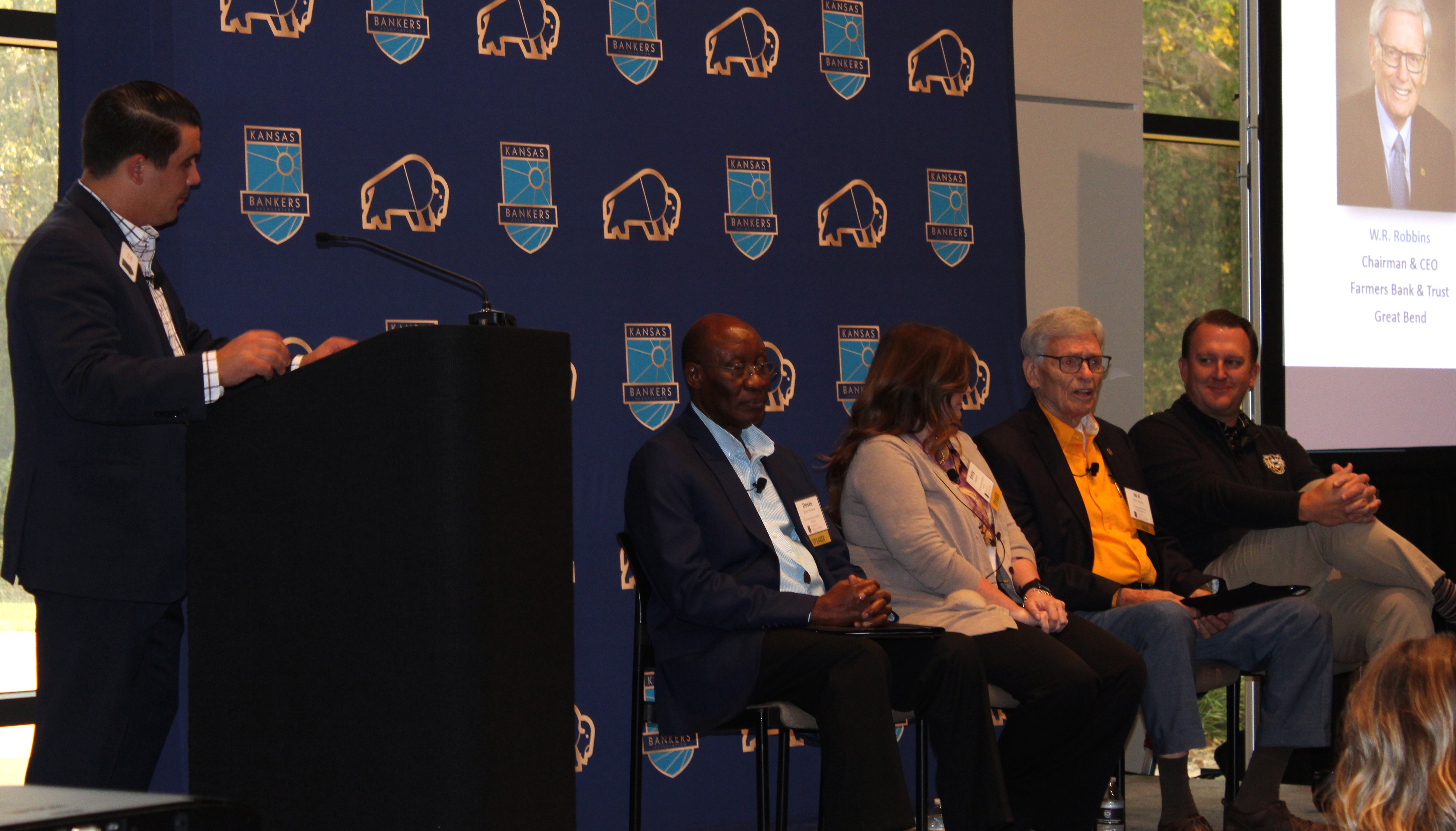 Panelists Dosse Toulaboe, Emily Breit, W.R. Robbins, and Jason Williby discuss banking with moderator Alex Orel of the Kansas Bankers Association.