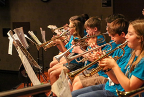 Band students playing instruments.